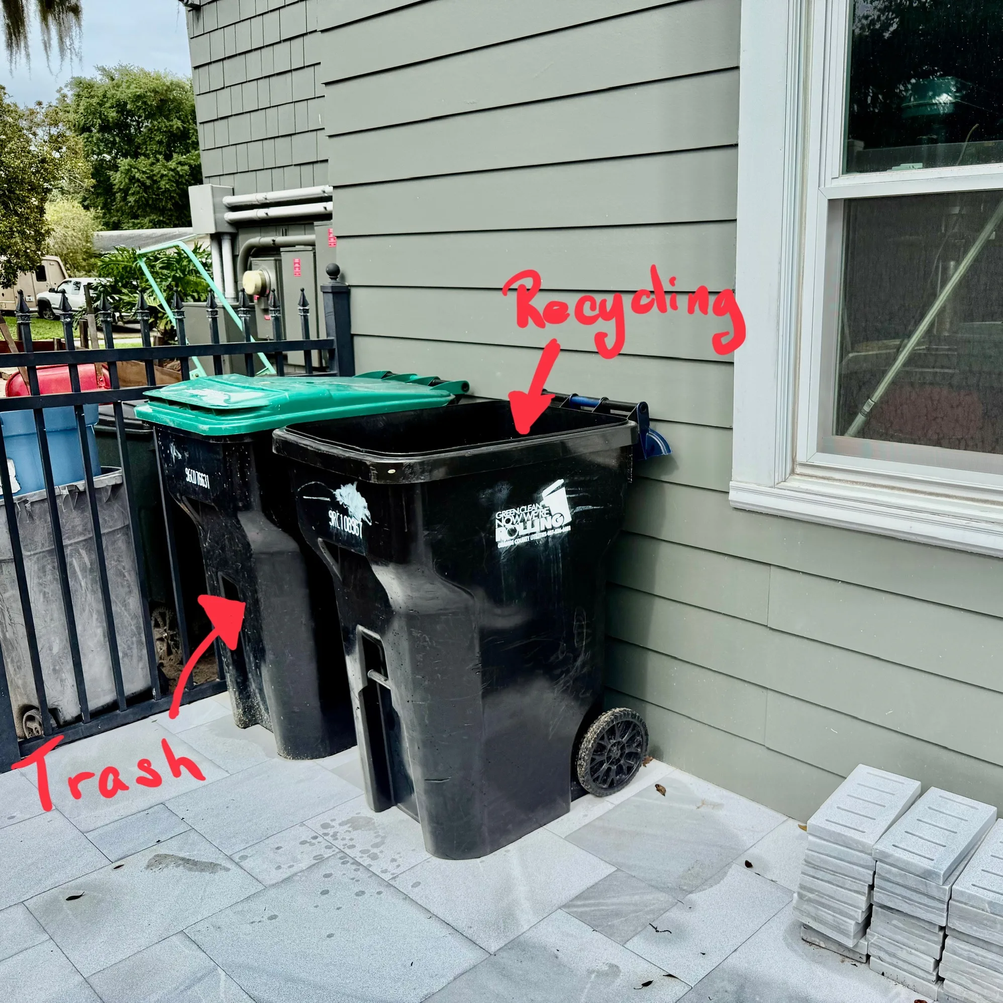 Green trash can and blue recycling can